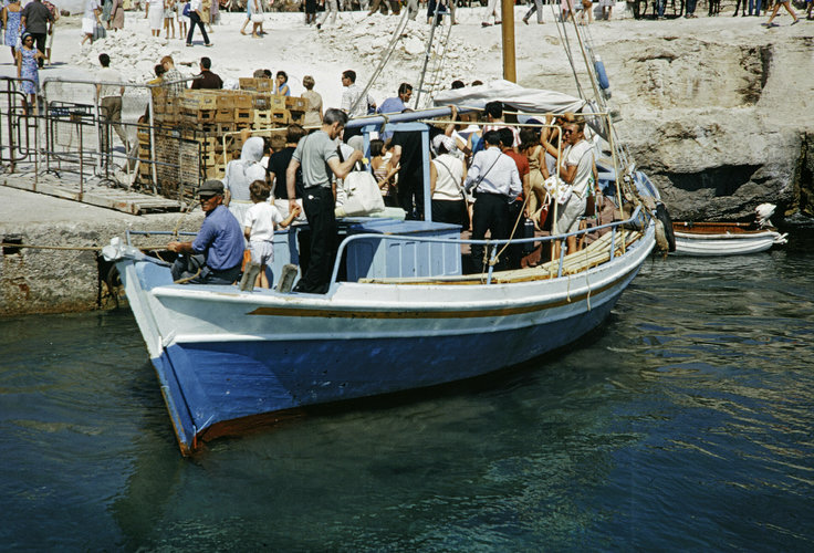 passengers departing boat docked at Aegina Island.jpg