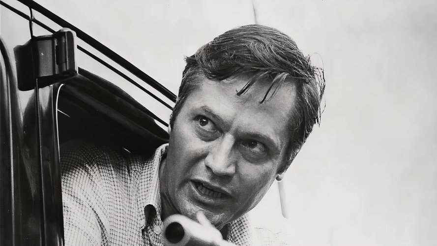 roger-corman-hanging-outside-a-car.jpg
